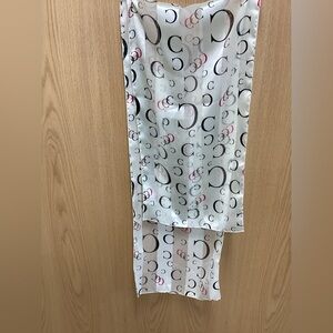 Chic Cream Scarf with Multicolor Coach Pattern